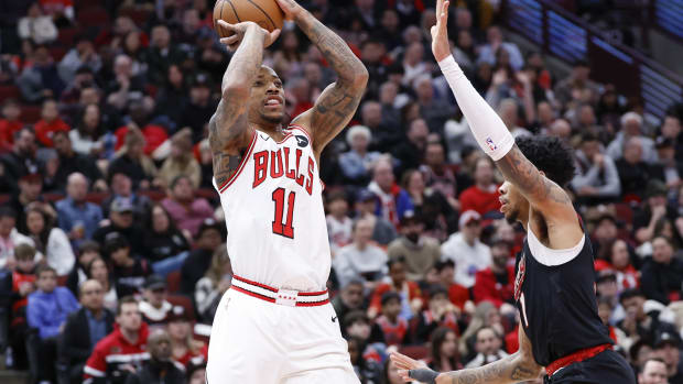 Chicago Bulls forward DeMar DeRozan (11) shoots against Portland Trail Blazers guard Anfernee Simons (1) during the first half at United Center. 